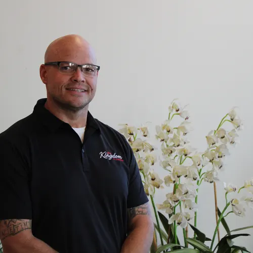 Smiling Kingdom Plumbing technician in glasses, a licensed Las Vegas plumber